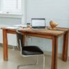 Computer on a Wooden Desk with the Designer's Business Website on the Screen